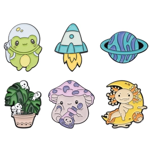 Space series enamel pins featuring astronaut frog and alien creature designs
