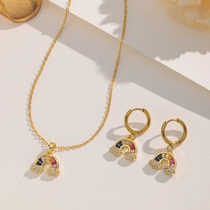 Detail of gold rainbow cloud jewelry set with vibrant multi-color zircon stones