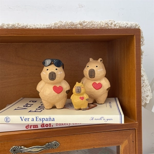 Handcrafted wooden capybara figurine set with sunglasses and heart motifs for home decor