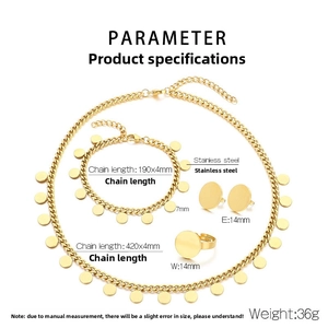 Macro view of golden stainless steel jewelry set including round plate necklace and bracelet
