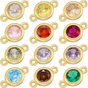 Macro view of twelve colorful round birthstone connectors in golden metal frames