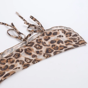 Detail of leopard print mesh sleeve with adjustable ties and fine stitching finish