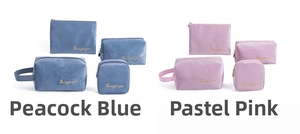 Detail of four-piece velvet makeup bag sets in pink and blue with gold embroidery