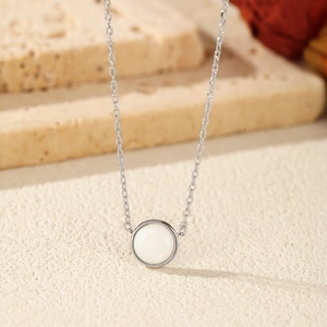 Elegant S925 sterling silver necklace featuring a round white opal pendant for women