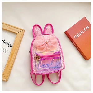 Detail of sequined pink kids backpack with rabbit ears, big bow and holographic pocket
