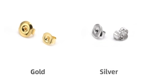 Detail view of gold and steel butterfly earring backs showing front and side designs