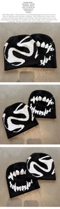 Detail of black knit beanie featuring white jacquard pattern for 54-58cm head size