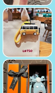 Detail of creative leather bus and motorcycle keychains with premium gift box packaging
