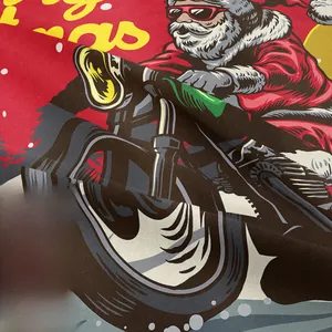 Close-up of vibrant screen-printed rock-style Santa Claus on red bohemian fabric