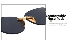 Detail of comfortable gold metal nose pads and dark grey lenses on kid's sunglasses