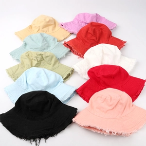 Frayed edge bucket hat for women made of washed cotton in assorted solid colors