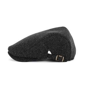 Classic dark grey wool blend newsboy cap with an adjustable buckle on a white background