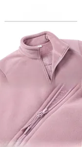 Detail of stand collar and zipper on purple polar fleece jacket with thick warm lining