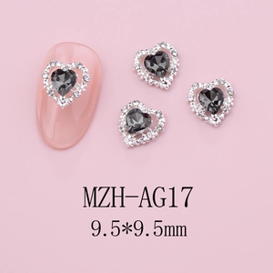 Macro shot of 9.5mm heart nail charm with grey crystal and silver alloy base for DIY art