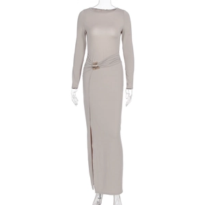 Detail view of taupe slim fit dress showing waist ruching with gold metal ring and high slit
