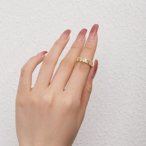 Close-up of golden S925 silver ring with oval 5A cubic zirconia on model finger