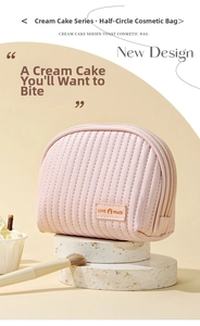 Macro shot of vertical quilted cream cake series cosmetic bag with textured pink finish