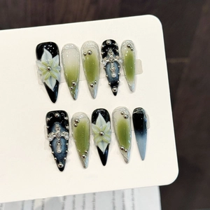 Handmade stiletto press-on nails with dark green and black gradient, 3D flowers and cross