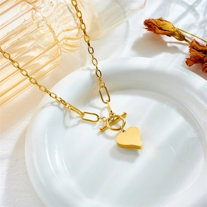 Gold-plated mixed chain necklace featuring a solid heart pendant and stylish OT toggle clasp