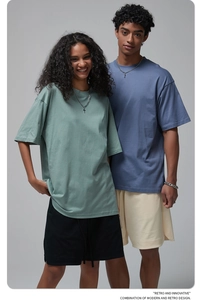 Detail of high-quality oversized cotton t-shirt and matching shorts in Morandi colors