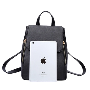 Chic black textured PU leather backpack with gold zippers shown next to an iPad for scale