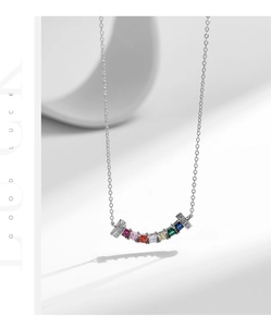 Detailed macro view of 925 silver necklace with rainbow square-cut gemstone pendant