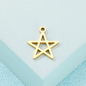 Minimalist 16mm hollow golden star pendant accessory on light blue textured background
