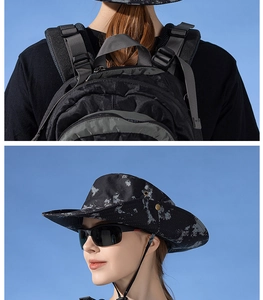 Detail of camouflage sun hat with wide brim and adjustable chin strap for outdoor use