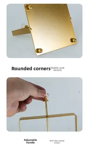 Detail of golden napkin holder with crystal crown handle and rounded corner base