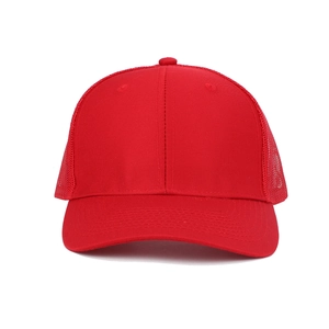 Front view of a red mesh trucker hat featuring a cotton twill front and breathable back