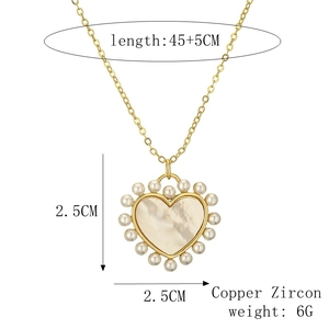 Detail showing dimensions of heart pendant necklace with pearl and white shell insets