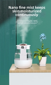 Macro view of a desktop USB humidifier with digital display showing fine mist output