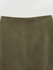 Close-up of military green suede midi skirt showing high-quality vertical stitching details