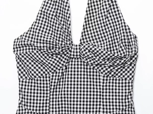 Detail of black and white gingham halter dress with twisted knot chest design