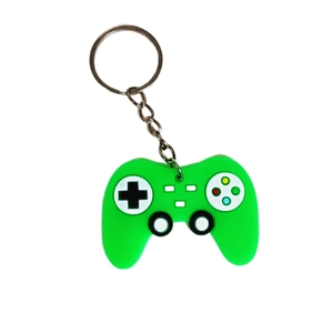 Green PVC game controller keychain with metal ring isolated on white background