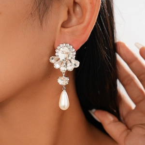 Elegant Baroque silver needle drop earring with crystals and pearl on a model