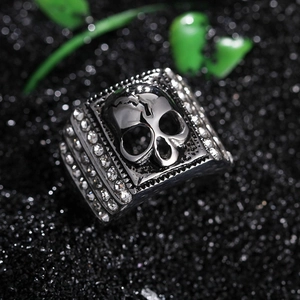 Gothic silver skull ring for men with side-set cubic zirconia on black crystal base