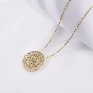 Gold plated necklace with a circular open heart pendant and marquise cut zircon stones