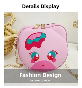 Detailed view of pink cartoon cat purse with gold chain strap and dual zipper closure