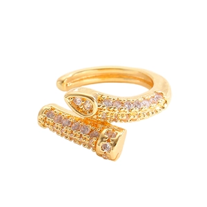 Detailed view of nail-shaped gold ring with white cubic zirconia pavé settings