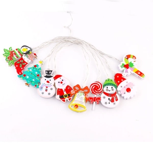 Festive LED string lights with Santa and snowman wooden figures on white background