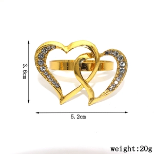 Detailed size view of a gold double heart napkin ring with sparkling white rhinestones