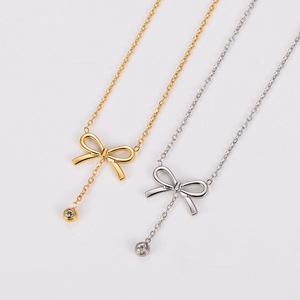 Elegant bow tie tassel necklace with sparkling rhinestone in gold and silver finish