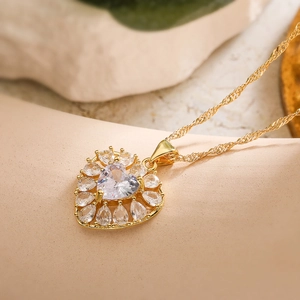 Elegant gold plated heart pendant necklace with shimmering cubic zirconia and twisted chain