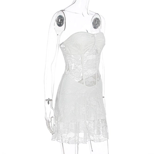 Detail of white floral lace tube dress with waist boning and sheer mini skirt layers