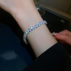 Macro shot of multi-row shimmering zircon crystals on an elegant silver-toned bracelet