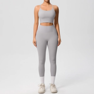 Detail view of double-sided brushed fabric on light grey yoga set with seamless stitching