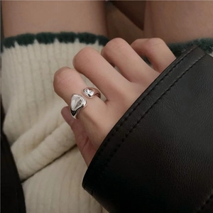 Detail of minimalist 925 sterling silver ring with liquid metal irregular design