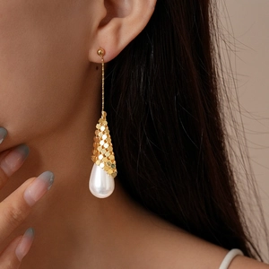 Detail view of 18k gold plated long drop earrings with sequins and white waterdrop pearl