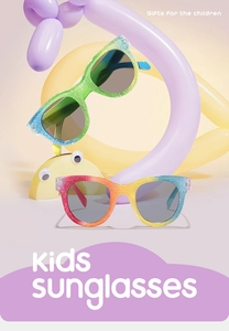 Close-up of kids sunglasses with glitter rainbow frames and UV protective lenses